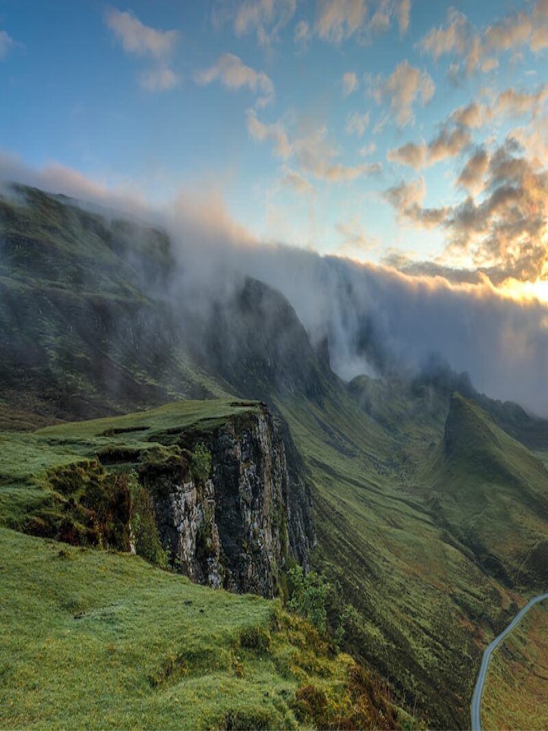 Misty green sunrise hills creating a serene luxury nature travel experience